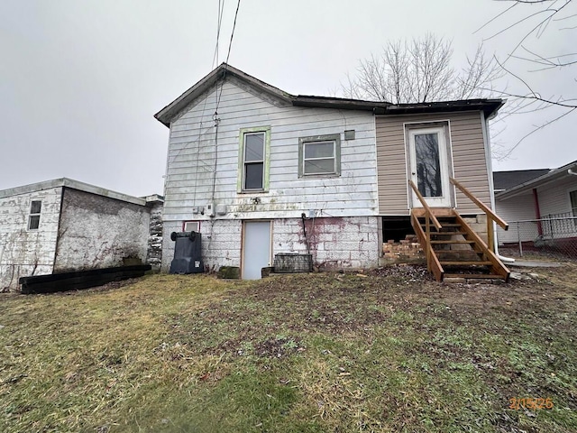 530 Harrison St, New Lexington, OH 43764 - back of property featuring entry steps and a yard