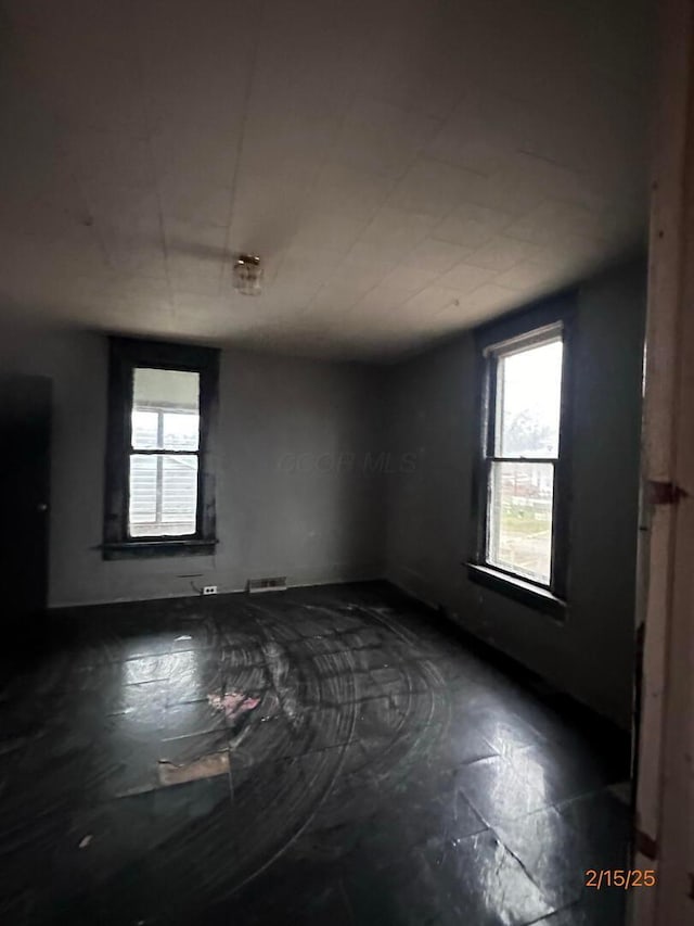 530 Harrison St, New Lexington, OH 43764 - empty room with a healthy amount of sunlight and visible vents