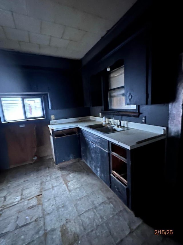 530 Harrison St, New Lexington, OH 43764 - kitchen featuring light countertops and a sink