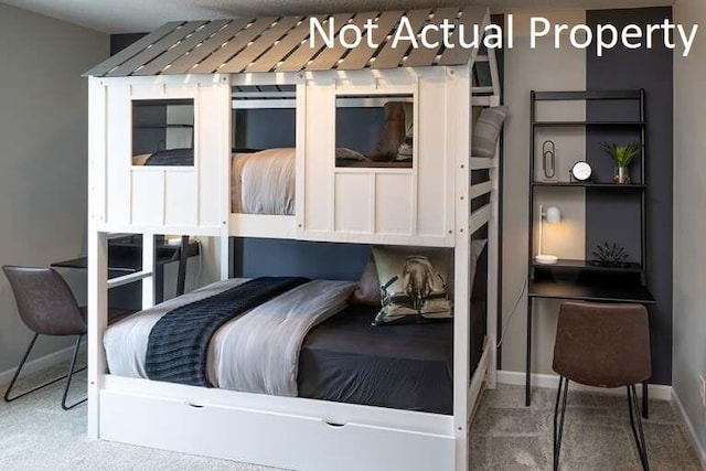 carpeted bedroom with baseboards