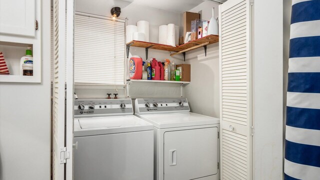 washroom with laundry area and separate washer and dryer
