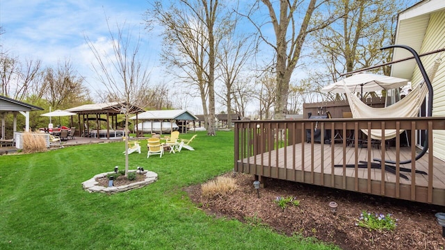 view of yard featuring a gazebo and a wooden deck