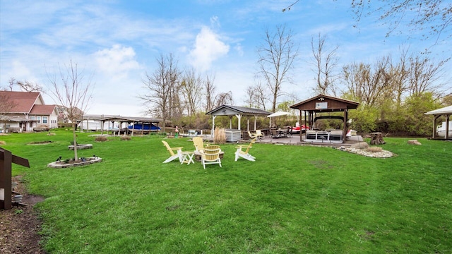 view of yard featuring a gazebo and a trampoline