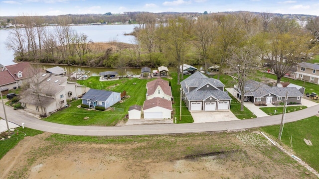 drone / aerial view with a residential view and a water view