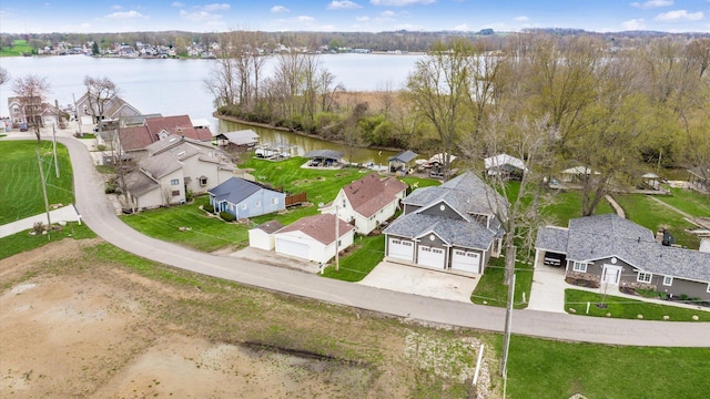 birds eye view of property featuring a residential view and a water view