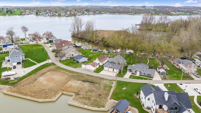 bird's eye view with a residential view and a water view