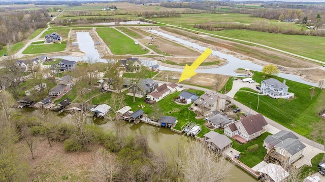 aerial view with a residential view and a water view
