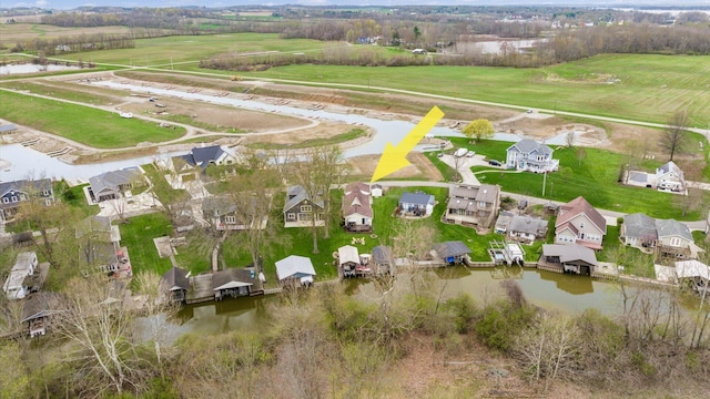 bird's eye view with a residential view and a water view