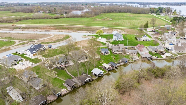 drone / aerial view with a residential view and a water view