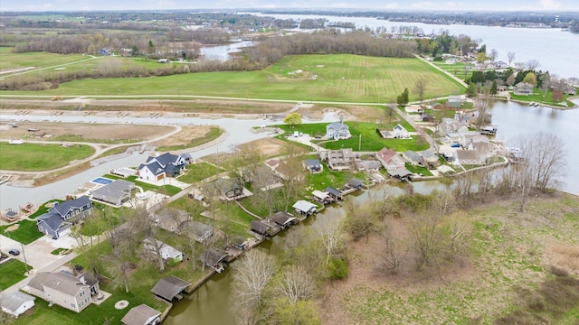 bird's eye view with a residential view and a water view