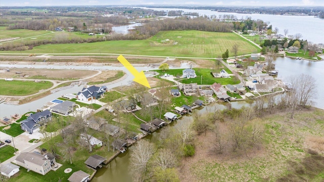 bird's eye view featuring a residential view and a water view