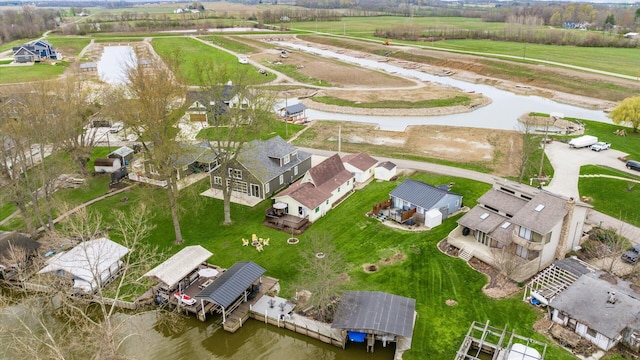 birds eye view of property featuring a residential view and a water view