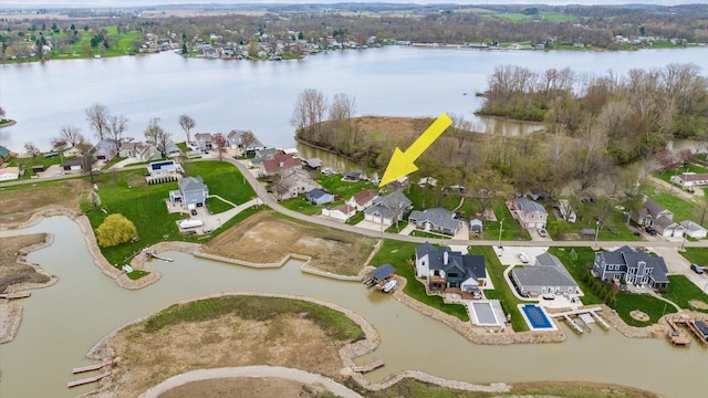 aerial view featuring a water view and a residential view