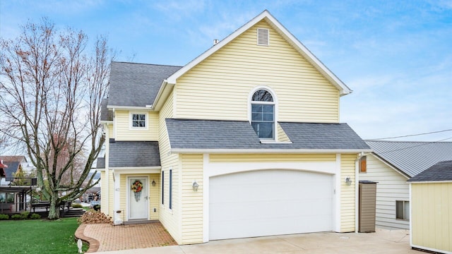 40 Beacon Light Ln, Buckeye Lake, OH 43008 - view of front of property with a shingled roof, concrete driveway, and a front yard