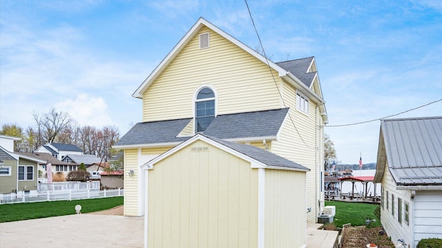 40 Beacon Light Ln, Buckeye Lake, OH 43008 - exterior space with an outdoor structure, cooling unit, and fence