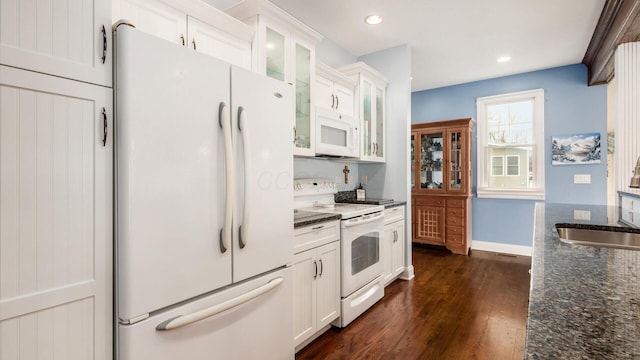 40 Beacon Light Ln, Buckeye Lake, OH 43008 - kitchen featuring white cabinets, white appliances, a sink, and dark stone counters