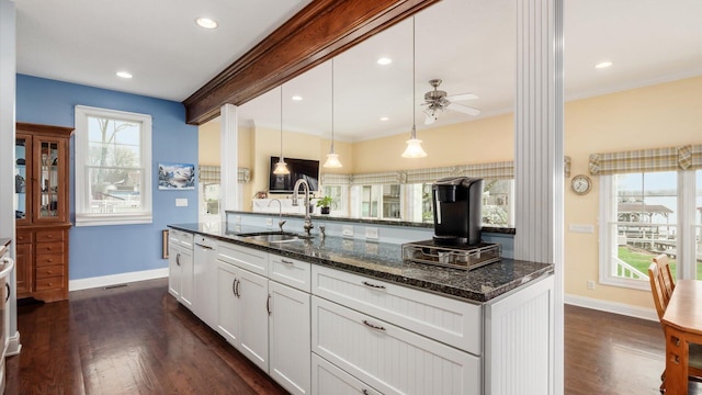 40 Beacon Light Ln, Buckeye Lake, OH 43008 - kitchen with white cabinetry, a sink, dark stone counters, and dark wood finished floors