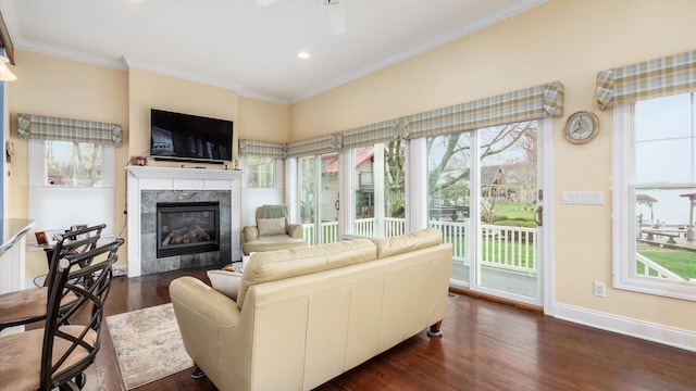40 Beacon Light Ln, Buckeye Lake, OH 43008 - living room featuring dark wood-style flooring, baseboards, ornamental molding, a fireplace, and a ceiling fan