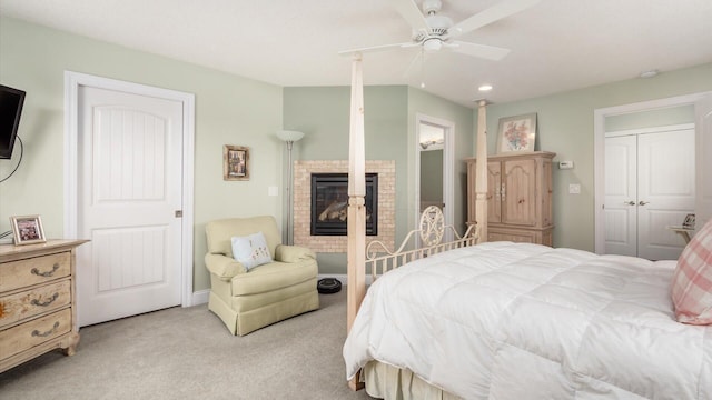 40 Beacon Light Ln, Buckeye Lake, OH 43008 - bedroom with a glass covered fireplace, light colored carpet, and ceiling fan