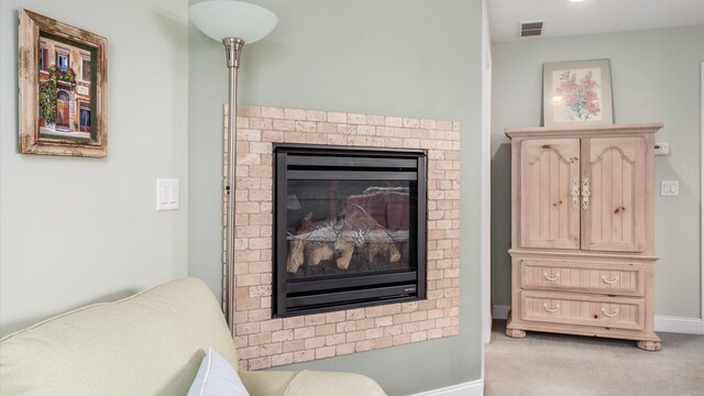 40 Beacon Light Ln, Buckeye Lake, OH 43008 - room details featuring visible vents, baseboards, carpet flooring, and a fireplace
