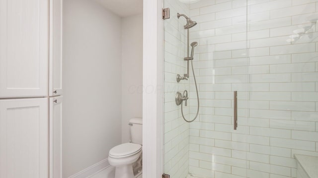 40 Beacon Light Ln, Buckeye Lake, OH 43008 - bathroom featuring a shower stall, baseboards, and toilet