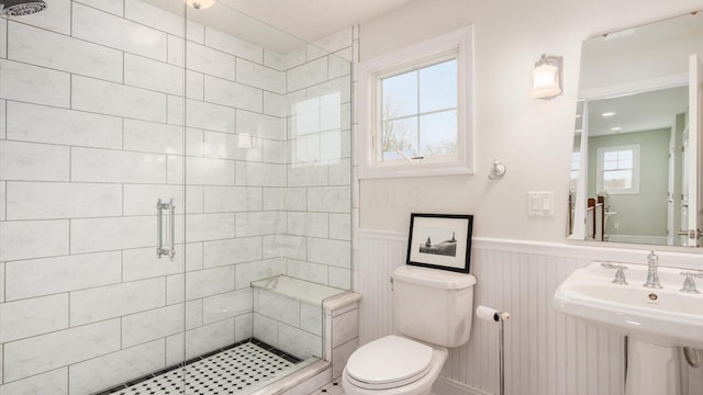 40 Beacon Light Ln, Buckeye Lake, OH 43008 - full bathroom with toilet, a stall shower, and wainscoting
