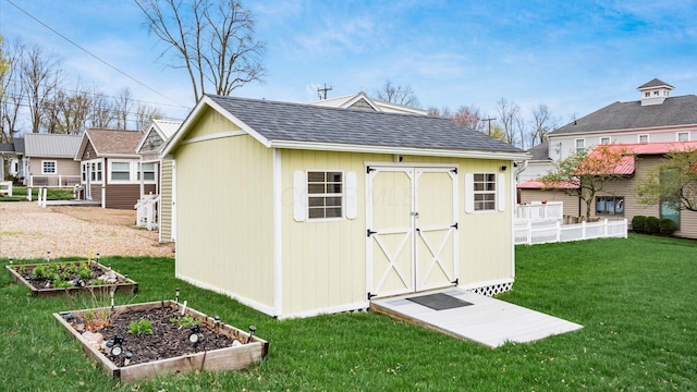 40 Beacon Light Ln, Buckeye Lake, OH 43008 - view of shed featuring a garden and fence