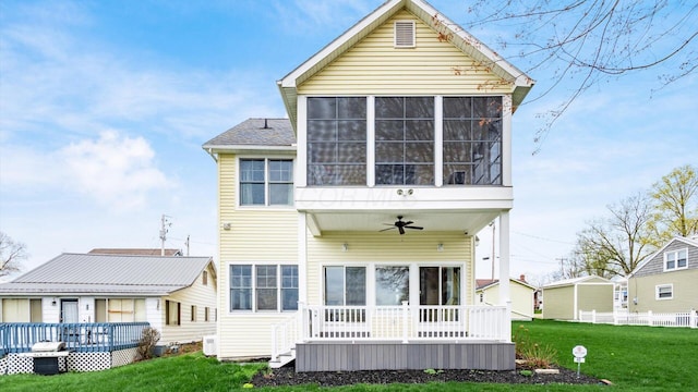 40 Beacon Light Ln, Buckeye Lake, OH 43008 - back of house featuring a yard, a wooden deck, a sunroom, and ceiling fan