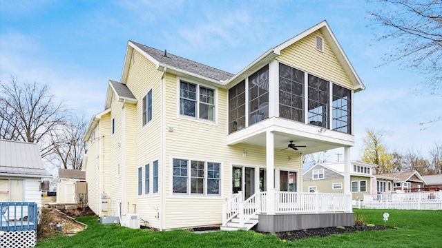 40 Beacon Light Ln, Buckeye Lake, OH 43008 - rear view of house featuring a sunroom, a yard, ceiling fan, and fence