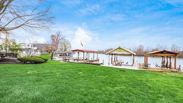 40 Beacon Light Ln, Buckeye Lake, OH 43008 - view of dock featuring boat lift, a water view, and a lawn
