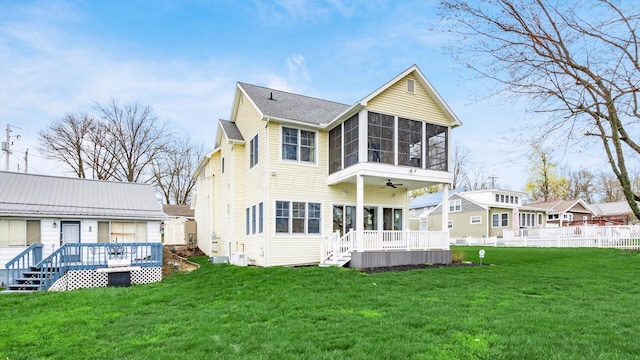 40 Beacon Light Ln, Buckeye Lake, OH 43008 - back of property with a sunroom, a yard, and fence