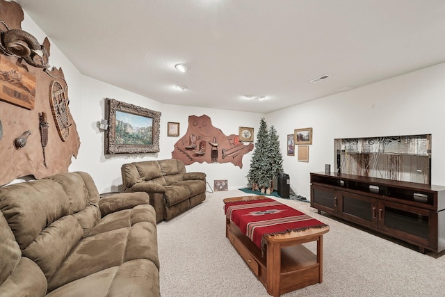 carpeted living area featuring visible vents