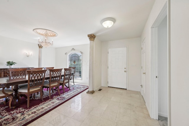 dining space featuring baseboards and an inviting chandelier