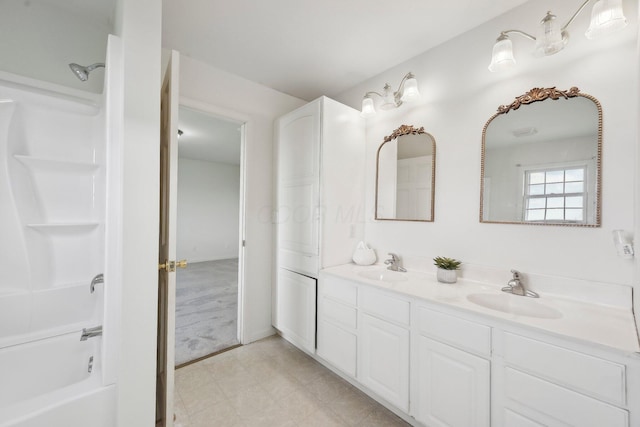 full bathroom with double vanity, a sink, and shower / washtub combination