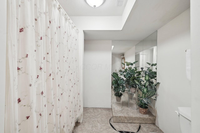 hall featuring visible vents