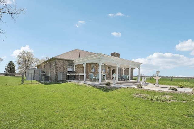back of property featuring a patio, a pergola, central AC, fence, and a lawn