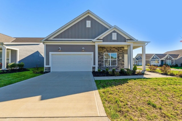 craftsman house with stone siding, a garage, board and batten siding, concrete driveway, and a front lawn