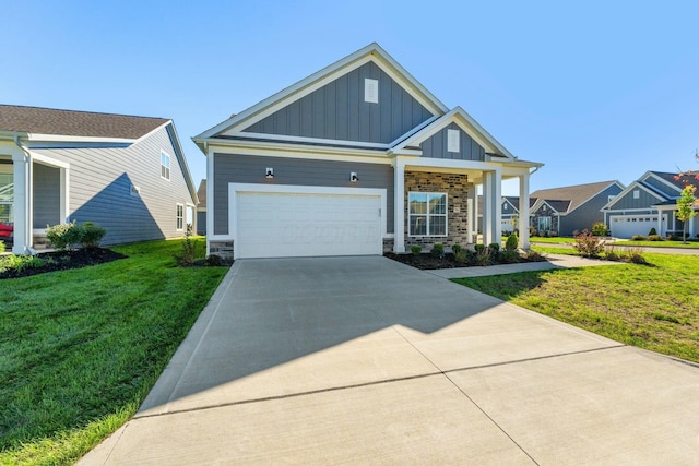 craftsman-style house featuring a front yard, an attached garage, stone siding, board and batten siding, and concrete driveway