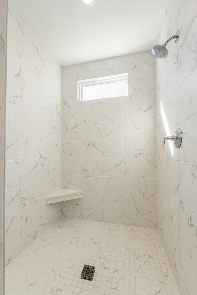 full bathroom featuring a tile shower