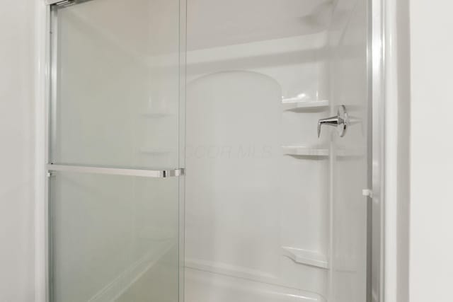 bathroom featuring a stall shower