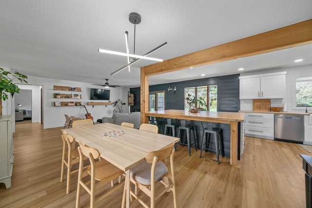 dining room with light wood-type flooring, beamed ceiling, a ceiling fan, and recessed lighting