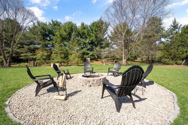 view of yard with an outdoor fire pit and a patio area