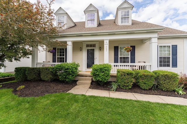 4497 Battles St, New Albany, OH 43054 - new england style home featuring a porch, roof with shingles, and a front yard