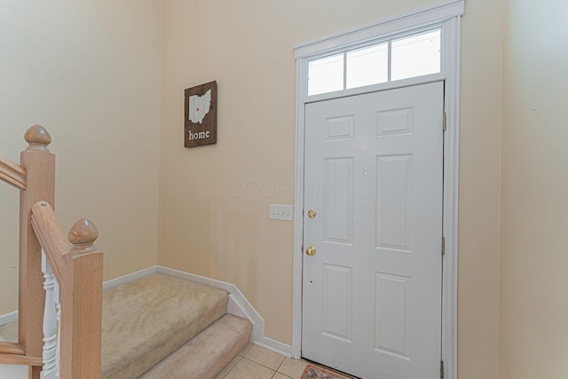 4497 Battles St, New Albany, OH 43054 - foyer featuring baseboards, light tile patterned floors, and stairway