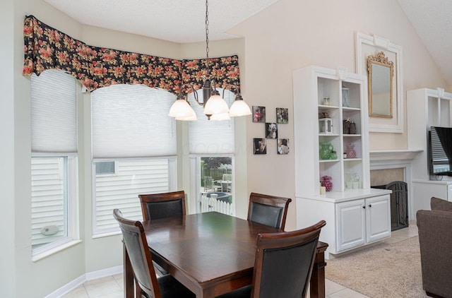 4497 Battles St, New Albany, OH 43054 - dining space with light tile patterned flooring, healthy amount of natural light, a textured ceiling, and a fireplace