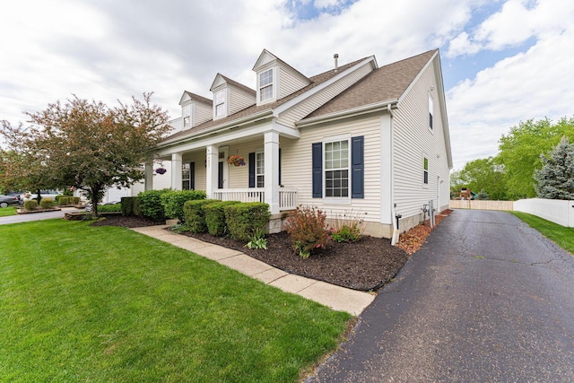 4497 Battles St, New Albany, OH 43054 - new england style home with a porch, a shingled roof, and driveway