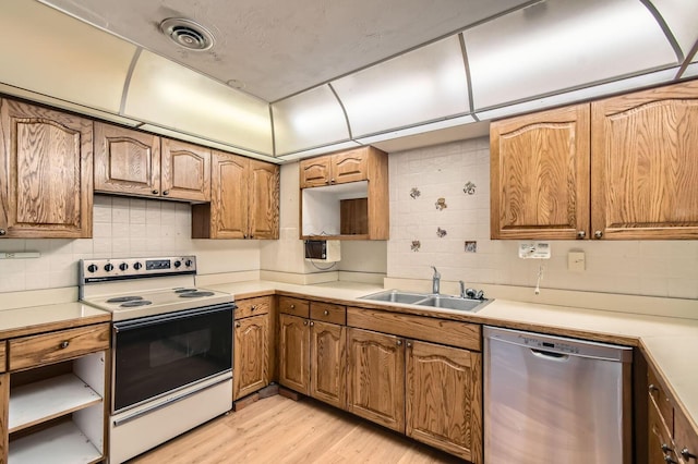 kitchen featuring tasteful backsplash, light countertops, white range with electric stovetop, dishwasher, and a sink