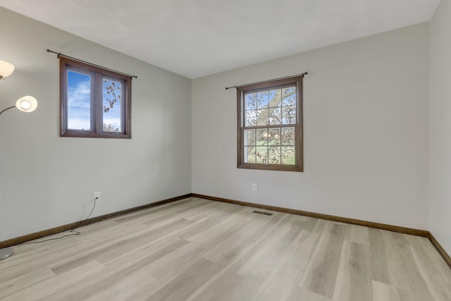8015 Alspach Rd NW, Lancaster, OH 43130 - spare room with visible vents, baseboards, and light wood-type flooring