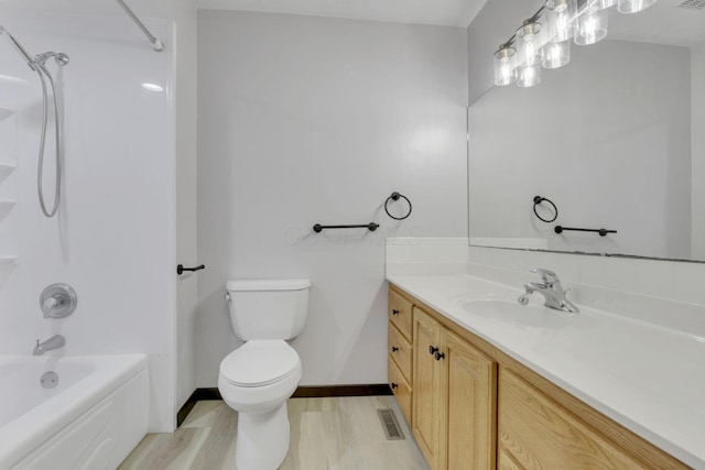 8015 Alspach Rd NW, Lancaster, OH 43130 - full bathroom with vanity, baseboards, toilet, bathtub / shower combination, and wood finished floors