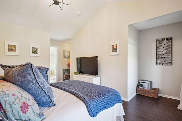bedroom with baseboards, vaulted ceiling, and dark wood finished floors